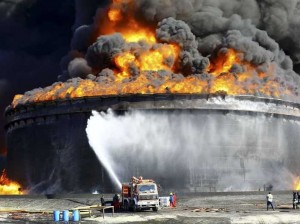 firefighters-work-to-put-out-the-fire-of-a-storage-oil-tank-at-the-port-of-es-sider-in-ras-lanuf-december-29-2014-reutersstringer