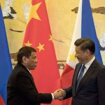 Philippines' President Rodrigo Duterte (L) and his Chinese counterpart Xi Jinping shake hands after a signing ceremony in Beijing on October 20, 2016. 
Duterte met with his Chinese counterpart Xi on October 20, state media said, as the Philippines leader seeks closer ties with the Asian giant while blasting his US allies. / AFP / POOL        (Photo credit should read /AFP/Getty Images)