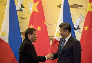 Philippines' President Rodrigo Duterte (L) and his Chinese counterpart Xi Jinping shake hands after a signing ceremony in Beijing on October 20, 2016. 
Duterte met with his Chinese counterpart Xi on October 20, state media said, as the Philippines leader seeks closer ties with the Asian giant while blasting his US allies. / AFP / POOL        (Photo credit should read /AFP/Getty Images)