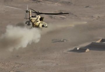 TOPSHOT - An Iraqi army Mi-35 helicopter shoots a missile at an Islamic State (IS) group target near the village of Tall Abtah, near the city of Mosul on November 25, 2016, during a massive operation to oust IS jihadists from the country's second city. Around 70,000 people have fled their homes in the region since the start on October 17 of a huge offensive against Mosul, only about 30,000 of them from inside the city itself. / AFP PHOTO / THOMAS COEX