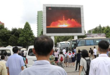 people are looking at the news that the second test-fire of ICBM Hwasong-14 was successfully carried out at night of July 28, Juche 106 (2017) under the supervision of Kim Jong Un, chairman of the Workers' Party of Korea, chairman of the State Affairs Commission of the DPRK and supreme commander of the Korean People's Army, at the Pyongyang railway station, in Pyongyang, DPRK, on Saturday, July 29th. (AP Photo/Jon Chol Jin)