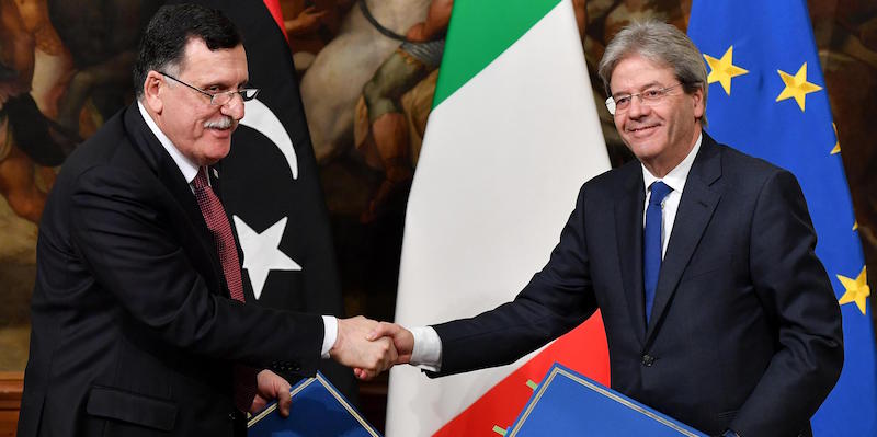 Italian Prime Minister Paolo Gentiloni (R) and Prime Minister of Libya Fayez al-Sarraj (Fayez al-Serraj) sign an agreement on Immigration at Chigi palace in Rome, Italy, 02 February 2017. ANSA/ETTORE FERRARI