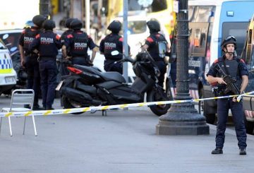 Armed policemen stand in a cordoned off area after a van ploughed into the crowd, injuring several persons on the Rambla in Barcelona on August 17, 2017. Police in Barcelona said they were dealing with a "terrorist attack" after a vehicle ploughed into a crowd of pedestrians on the city's famous Las Ramblas boulevard on August 17, 2017. Police were clearing the area after the incident, which has left a number of people injured. / AFP PHOTO / Josep LAGO (Photo credit should read JOSEP LAGO/AFP/Getty Images)