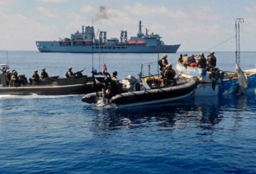 Royal Marines raiding craft from Fleet Contingency Troop (FCT), Fleet Protection Group Royal Marines (FPGRM) boarding and searching a Somalian Pirate Vessel. RFA Fort Victoria is pictured in the background. The Pirates were later taken onboard RFA Fort Victoria for repatriation and the vessel was destroyed.