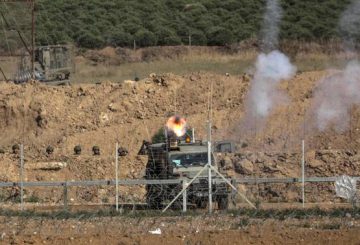 epa06741650 Israeli army fire tear-gas during clashes near the border with Israel in the east of Gaza Strip, 15 May 2018 (issued 16 May 2018). According to Palestinian medical sources, two Palestinian protesters were shot dead by the Israeli army on 15 May in Gaza, while thousands of Palestinians attended the funerals for some 25 of the 60 protesters killed a day earlier by the Israeli army during mass demonstrations. Palestinians are marking the Nakba Day, or the day of the disaster, when more than 700 thousand Palestinians were forcefully expelled from their villages during the war that led to the creation of the state of Israel on 15 May 1948. Protesters call for the right of Palestinians to return to their homeland. EPA/MOHAMMED SABER