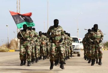 epa04486669 Libyan Army soldiers parade during a graduation ceremony of the first batch of the Tripoli air base security and protection batallion of the Presidency of the General Staff of the Libyan army, in Tripoli, Libya, 12 November 2014. EPA/STR