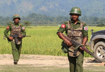 In this photograph taken on October 21, 2016, armed Myanmar army soldiers patrol a village in Maungdaw located in Rakhine State as security operation continue following the October 9, 2016 attacks by armed militant Muslim. - The United Nations called for an investigation into claims Myanmar troops have been killing civilians and torching villages in northern Rakhine, as reports emerged thousands of Rohingya had been forced from their homes. (Photo by STR / AFP)