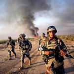 an iraqi army soldier conducts a foot patrol together with u.s. army soldiers from fox troop, sabre squadron, 3rd armored cavalry regiment, after they set a deserted village on fire, balad ruz, diyala province, iraq, 2008.

20 kms south of  balad ruz, fox troop, sabre squadron, 3acr, burning everything(AP Photo/Marko Drobnjakovic)