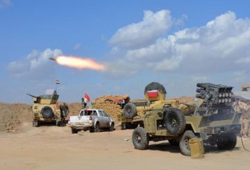 TOPSHOTS Iraqi government forces and allied militias fire weaponry from a position in the northern part of Diyala province, bordering Salaheddin province, as they take part in an assault to retake the city of Tikrit from jihadists of the Islamic State (IS) group, on March 2, 2015. Some 30,000 Iraqi troops and militia backed by aircraft pounded jihadists in and around Tikrit in the biggest offensive yet to retake one of the Islamic State group's main strongholds. Iraqi forces tried and failed several times to wrest back Tikrit, a Sunni Arab city on the Tigris river about 160 kilometres (100 miles) north of Baghdad. AFP PHOTO / YOUNIS AL-BAYATI