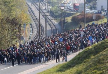 epa07207861 (FILE) - Migrants are escorted by Slovenian police officers toward the Slovenian-Austrian border crossing in Sentilj, Slovenia, 31 October 2015 (reissued 04 December 2018). Merkel defended her decision to take in thousands of refugees who were stuck in Hungary coming through the Balkan Route with the words 'We can manage' which earned her both respect for the humanitarian decision and criticism for ceasing the so-called Dublin Rules. A successor to Angela Merkel as chairwoman of her CDU party will be elected on 07 December 2018. Merkel said she will not run for re-election as CDU chairwoman nor for Chancellor nor for any other political office. EPA/GYORGY VARGA HUNGARY OUT ATTENTION: This Image is part of a PHOTO SET