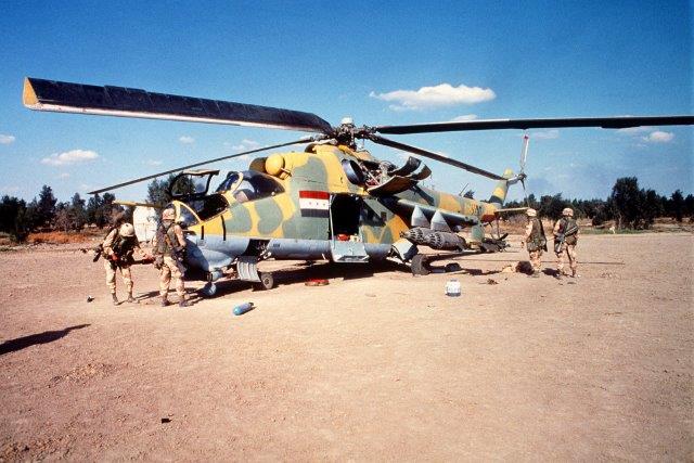 members-of-the-82nd-airborne-division-inspect-a-captured-iraqi-mil-mi-24-helicopter-7c85d8-1600