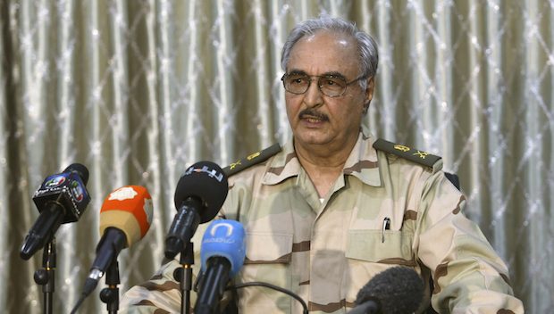 General Khalifa Haftar speaks during a news conference at a sports club in Abyar, a small town to the east of Benghazi. May 17, 2014. The self-declared Libyan National Army led by a renegade general told civilians on Saturday to leave parts of Benghazi before it launched a fresh attack on Islamist militants, a day after dozens were killed in the worst clashes in the city for months. Families could be seen packing up and driving away from western districts of the port city where Islamist militants and LNA forces led by retired General Haftar fought for hours on Friday, killing at least 43 people. REUTERS/Esam Omran Al-Fetori (LIBYA - Tags: CIVIL UNREST MILITARY POLITICS)
