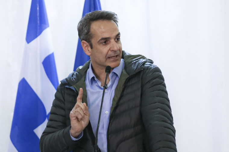 Greek Prime Minister Kyriakos Mitsotakis gestures during joint press statements with European Commission President Ursula von der Leyen and European Council President Charles Michel, in Kastanies at the Greek-Turkish border on Tuesday, March 3, 2020. Migrants and refugees hoping to enter Greece from Turkey appeared to be fanning out across a broader swathe of the roughly 200-kilometer-long land border Tuesday, maintaining pressure on the frontier after Ankara declared its borders with the European Union open.(AP Photo/Giannis Papanikos)