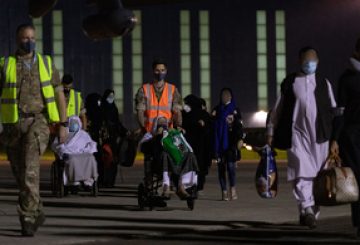 Image shows RAF Brize Norton personnel escorting passengers from a RAF Voyager aircraft during Op PITTING, captured today on the 26th August 2021. As part of Operation PITTING; eligible Afghans are being evacuated to the UK via the UAE under the Afghan Relocation and Assistance Program (ARAP). Some will land and be processed at RAF Brize Norton (BZZ). This represents a valuable opportunity to showcase the ability of the RAF, and in particular the Air Mobility Force, to deliver large scale Air Transport operations at short notice. The UK will continue to fulfil its international obligations and moral commitments. Officials continue to work to protect British nationals and help former UK staff and other eligible people to travel to the UK.