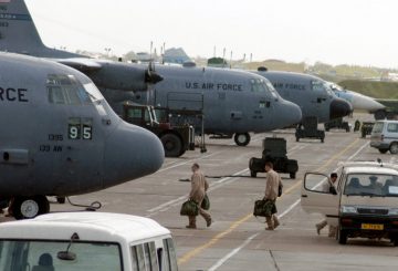 C-130 Hercules aircrew members board their aircraft for an Operation Enduring Freedom mission at Karshi-Khanabad Air Base, Uzbekistan, on April 19, 2005. (U.S. Air Force Photo/Master Sgt. Scott T. Sturkol)
