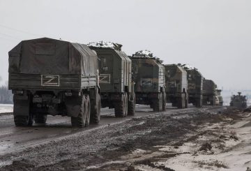 BELGOROD REGION, RUSSIA - FEBRUARY 26, 2022: A column of Russian military vehicles is seen near the village of Oktyabrsky, Belgorod Region, near the Russian-Ukrainian border. Early on 24 February, Russia's President Putin announced his decision to launch a special military operation after considering requests from the leaders of the Donetsk People's Republic and the Lugansk People's Republic. Anton Vergun/TASS Ðîññèÿ. Áåëãîðîäñêàÿ îáëàñòü. Ðîññèéñêàÿ âîåííàÿ òåõíèêà â ðàéîíå ïîñåëêà Îêòÿáðüñêèé ðÿäîì ñ ðîññèéñêî-óêðàèíñêîé ãðàíèöåé. Óòðîì 24 ôåâðàëÿ ïðåçèäåíò ÐÔ Âëàäèìèð Ïóòèí îáúÿâèë, ÷òî â îòâåò íà îáðàùåíèå ðóêîâîäèòåëåé Ëóãàíñêîé è Äîíåöêîé íàðîäíûõ ðåñïóáëèê îí ïðèíÿë ðåøåíèå î ïðîâåäåíèè ñïåöèàëüíîé âîåííîé îïåðàöèè. Àíòîí Âåðãóí/ÒÀÑÑ