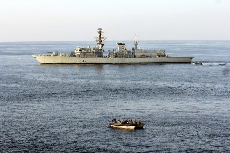 The boarding team recover the arms cache with HMS Montrose providing cover