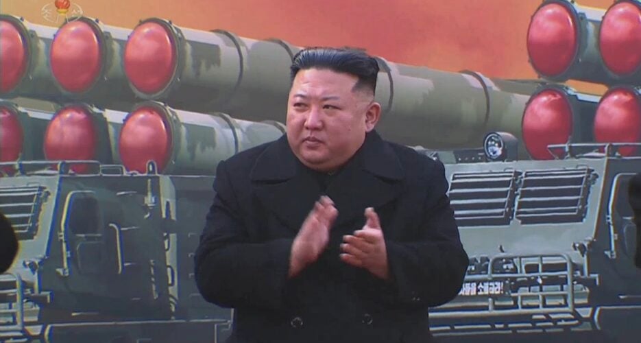 kctv-jan1-2023-kju-wpk-hq-600mm-mlrs-ceremony-artistic-render-anti-us-slogan-935x500